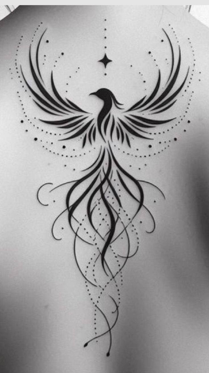 Phoenix tattoo on a back with stylized black lines and dot work patterns.