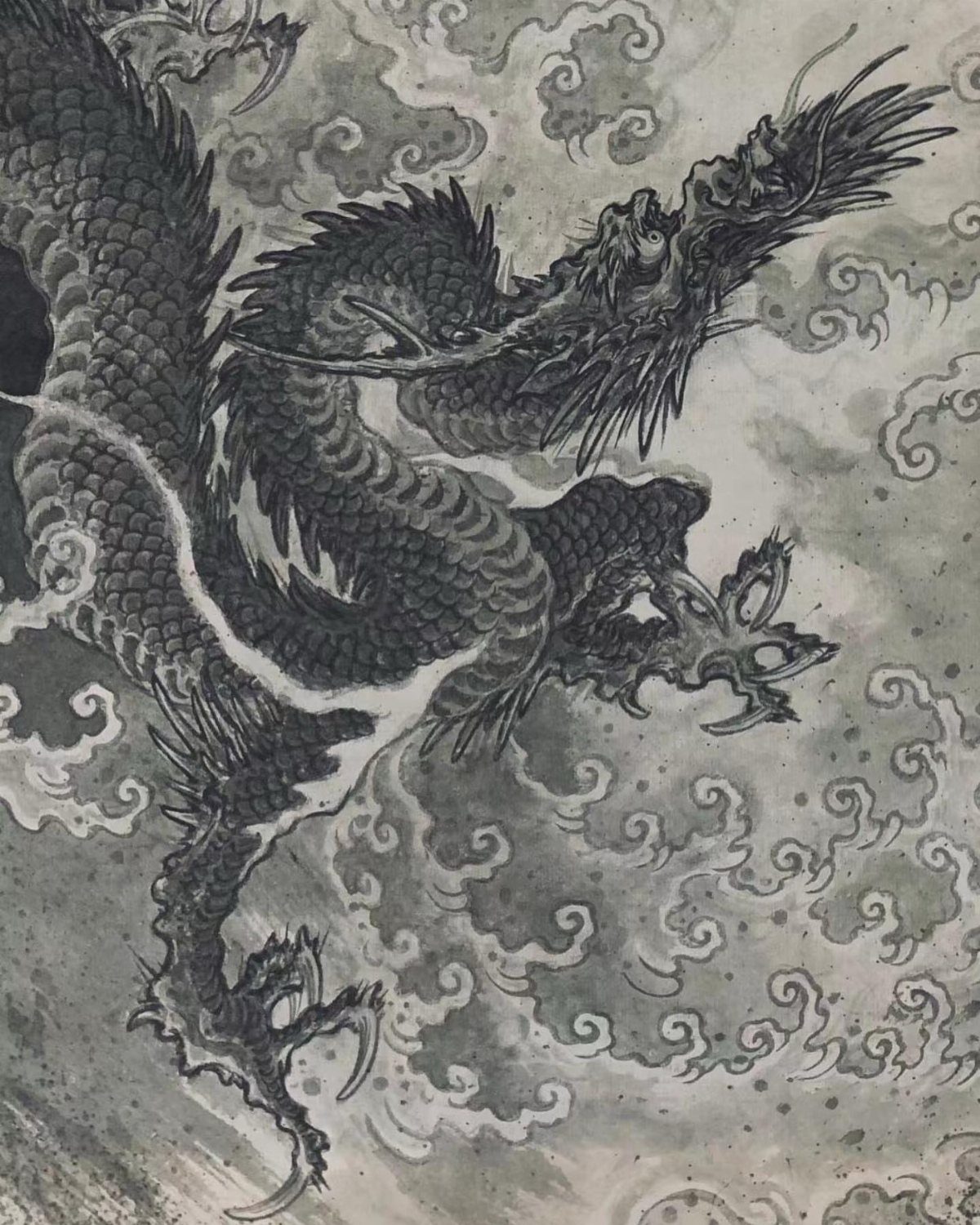 Chinese dragon ink drawing surrounded by swirling grey clouds and mist