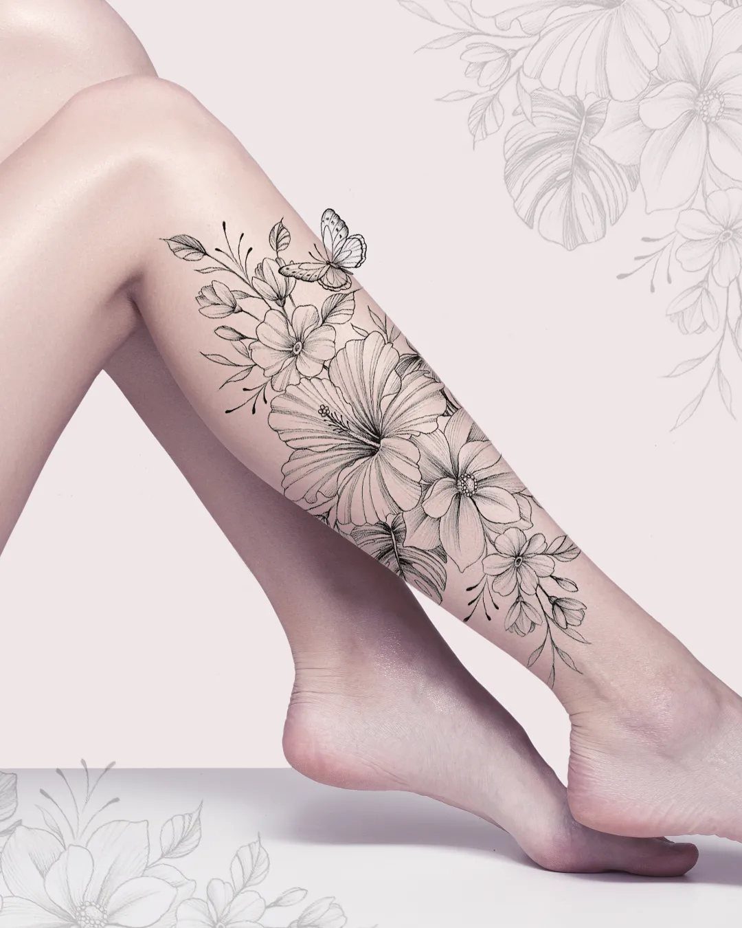 Hibiscus flower tattoo with butterfly and leaves on a person's lower leg