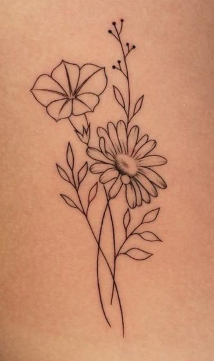 Fine-line black ink tattoo of a morning glory and a daisy on skin.