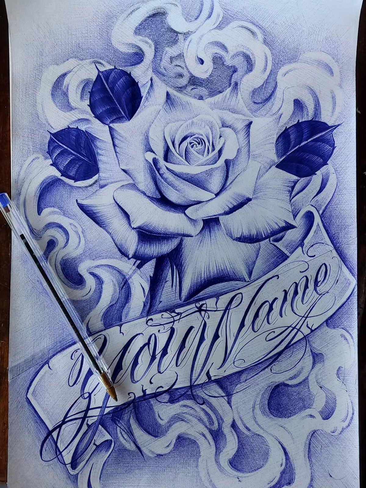 Blue ink drawing of a rose with a banner reading Your Name