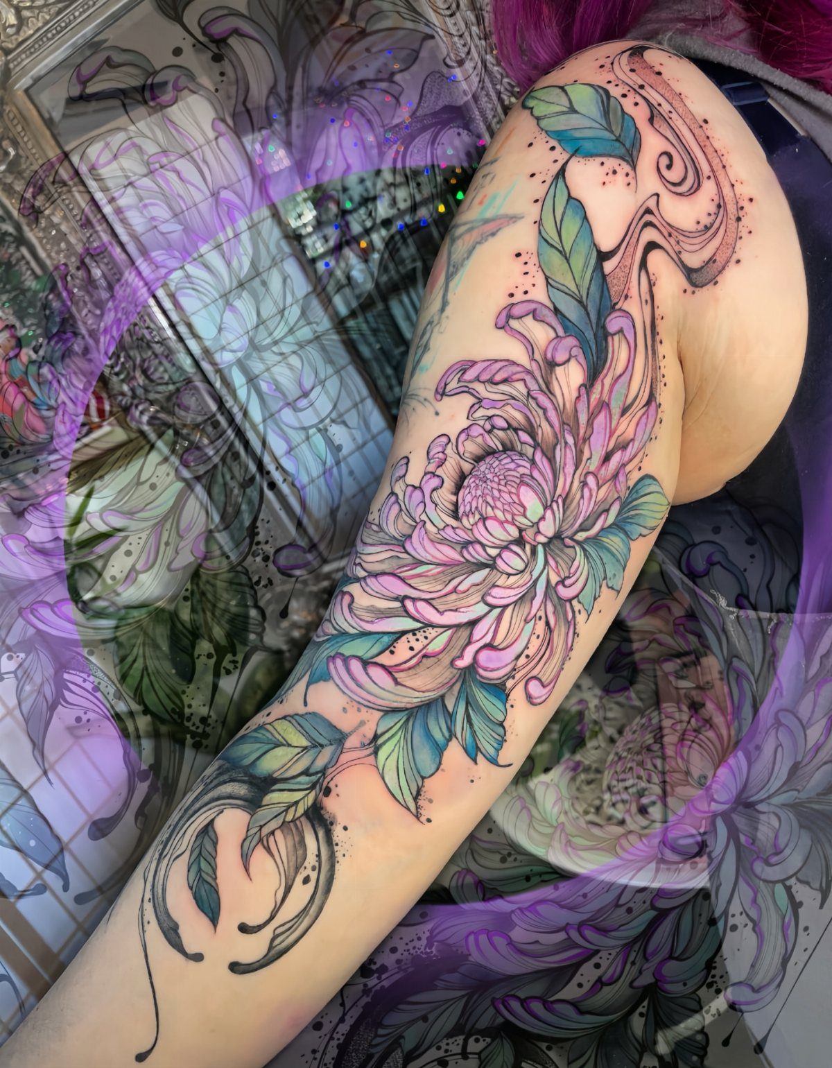 Chrysanthemum tattoo on an arm with pink petals and teal leaves.