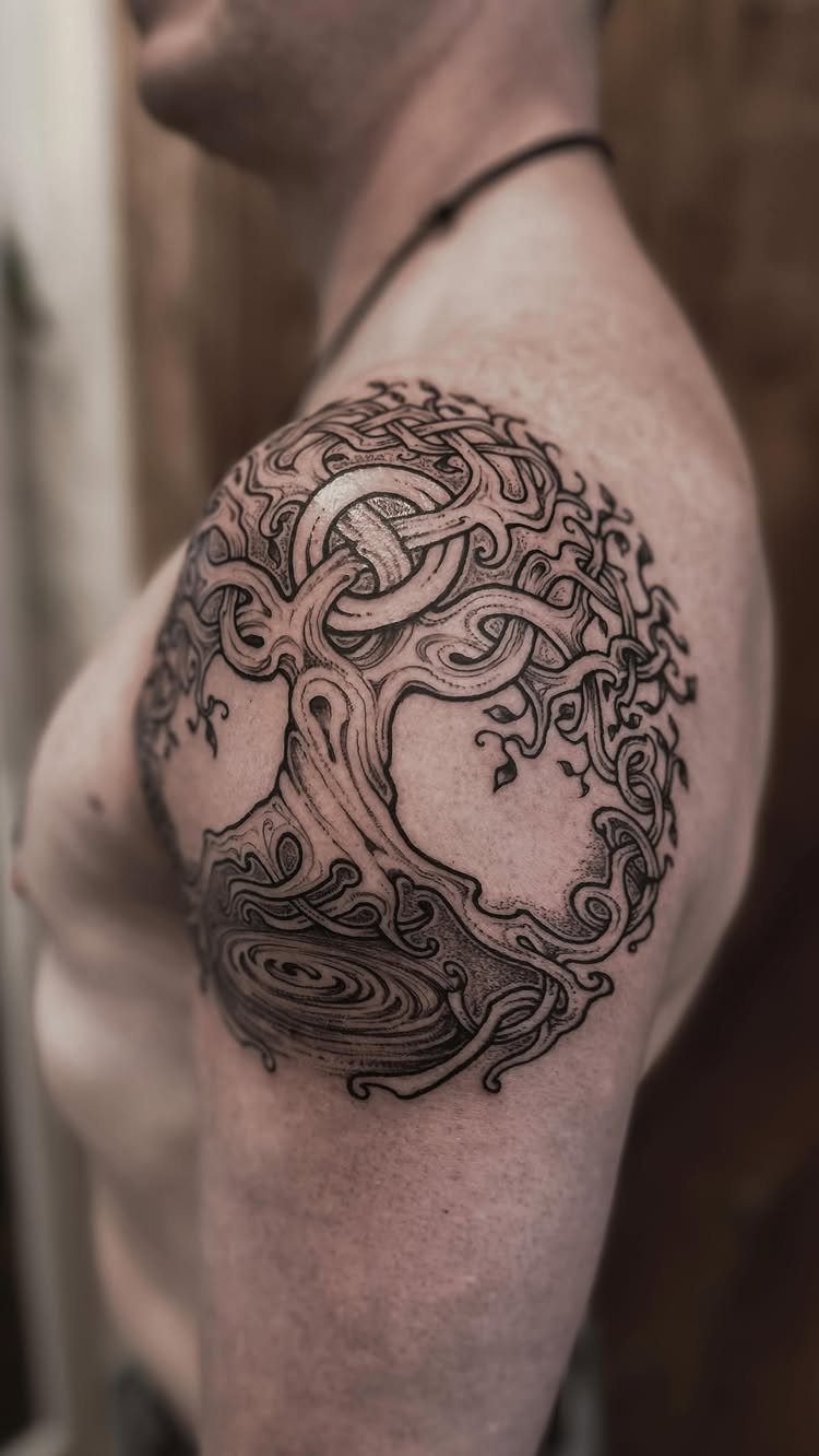 Celtic knotwork willow tree tattoo on a person's shoulder and upper arm